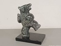 Front view of soapstone dancing bear on base