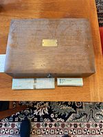 Closed wood flatware chest with maker boxes below