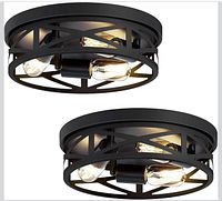 Pair of round black metal flush mount fixtures showing bulb sockets