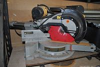 Front view of DeWalt sliding compound miter saw on shelf