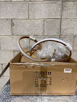 Box containing natural wood and white acrylic ring chandelier with cables and hardware