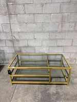 Full view of gold metal framed glass coffee table