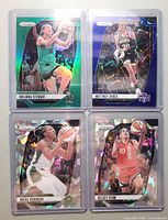 Front view of all four Prizm Superstar parallel cards in sleeves