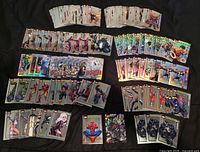Wide view of entire lot spread out showing multiple rows of base, refractor and insert cards