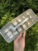 Interior top view showing lever marked "Magic Touch" and cube compartments