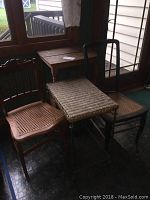 Photo of two caned chairs and two tables, showing wood wear and intact caning.