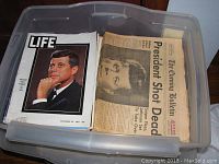 Bin with JFK Life magazines and newspapers related to his assassination