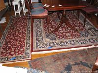 Full view of both rugs under dining table showing runner along left and area rug under table