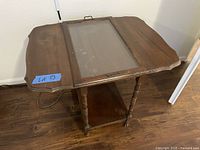 Full view of wood side table with glass insert
