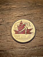 Reverse showing Cindy Klassen design over red maple leaf