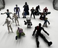 Group shot showing all 14 assorted action figures