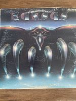 Front cover of Kansas "Song for America" vinyl LP showing artwork and band logo