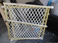 Evenflo gate front view showing mesh panel and locking bar