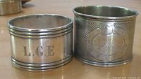 Both napkin rings side by side showing overall design and monograms