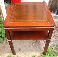Full top view showing leather inset with gold tooling and wood frame