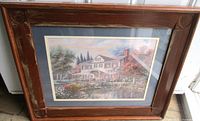 Full view of framed print showing image and wooden frame