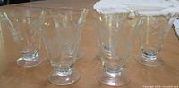 all six footed juice glasses on tabletop