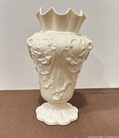 Front view of cream Belleek Rathmore porcelain vase