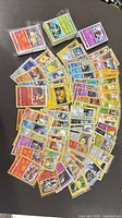 Overhead view showing entire spread of Pokémon cards and two brick stacks in sleeves