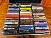 Full view of three columns of cassette tapes inside carry case
