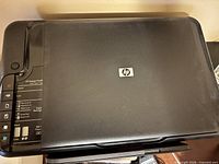 Top view showing HP logo and scanner lid