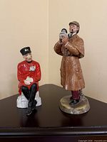 Both figurines displayed together