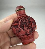 Front view showing landscape carving and stopper