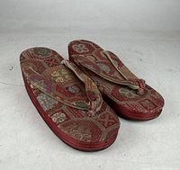Pair of red silk brocade zori sandals, top view