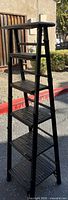 Full view of tapered 5-tier black bamboo-style etagere