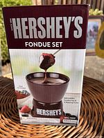 Front of Hershey's fondue set box showing bowl, chocolate, logo