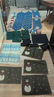 All pieces laid out: placemats, runner, tablecloth, napkins