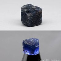 Rough sapphire crystal front view, showing dark blue exterior