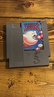 Front of Kirby's Adventure NES cartridge showing label and marker writing