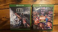 Front view of both Xbox One game cases side by side