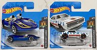 Front view of both sealed Hot Wheels cars on short cards