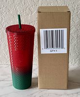 Tumbler beside plain shipping box showing barcode side