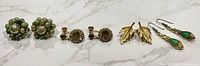 All four earring pairs lined in a row showing style and size relationships
