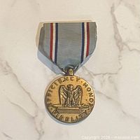 Front view showing "Efficiency Honor Fidelity" inscription and eagle design