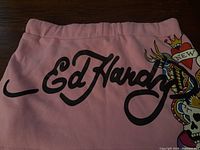 Front of shorts showing Ed Hardy logo and graphic print