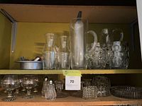 Shelf with full assortment of clear glass items