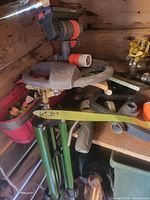 Overall view showing green tripod sprinkler, spray nozzle and assorted fittings