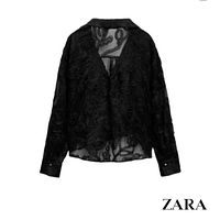 Front view of black ZARA sheer mesh blouse showing 3D floral appliqué