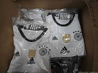 Multiple sealed Germany replica jersey sets in box