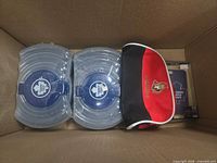 Top view showing two Maple Leafs containers, Senators pouch and boxed Leafs accessory