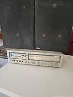 Front view of Panasonic receiver with cassette deck and two black bookshelf speakers stacked above