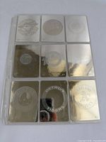 Nine holographic MLB logo cards in sleeve, front view