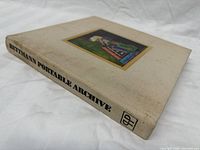 Spine and top board showing title, cloth texture and wear