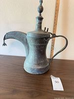 Full view of ewer showing overall form, patina, scale