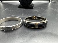 Both bracelets side by side on display surface