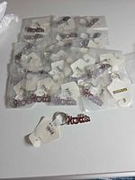 Group of sealed Urbanology Hottie keychains